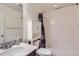Bathroom featuring a shower and tub combination with vanity and storage at 14641 E Poundstone Dr, Aurora, CO 80015