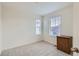 Cozy bedroom with neutral carpet and bright windows at 14641 E Poundstone Dr, Aurora, CO 80015