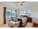 Primary bedroom with bright windows and a sitting area at 14641 E Poundstone Dr, Aurora, CO 80015