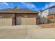 Double car garage with a concrete driveway at 14641 E Poundstone Dr, Aurora, CO 80015