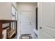 Welcoming hallway with tile floor, storage, and access to the home at 14641 E Poundstone Dr, Aurora, CO 80015