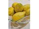 Close-up shot of fresh lemons in a glass bowl, perfect for a healthy lifestyle at 14641 E Poundstone Dr, Aurora, CO 80015