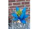 Outdoor decor with a colorful metal sculpture on a wrought iron stand at 14641 E Poundstone Dr, Aurora, CO 80015