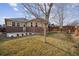 Landscaped backyard with patio and wooden fence at 25077 E Canal Pl, Aurora, CO 80018