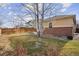 Backyard with grass, tree, and wooden fence at 25077 E Canal Pl, Aurora, CO 80018