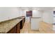 Long granite countertop and wet bar area in the basement at 25077 E Canal Pl, Aurora, CO 80018