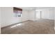 Bright, carpeted basement with window and light-filtering shades at 25077 E Canal Pl, Aurora, CO 80018
