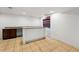 Basement wet bar featuring a granite countertop and tile flooring at 25077 E Canal Pl, Aurora, CO 80018