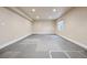 Finished basement room with gray floor mats and window at 25077 E Canal Pl, Aurora, CO 80018