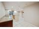 Basement wet bar with granite countertop and dark wood cabinets at 25077 E Canal Pl, Aurora, CO 80018