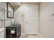 Basement bathroom with glass bowl sink, toilet and storage at 25077 E Canal Pl, Aurora, CO 80018