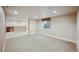 Finished basement with wet bar and carpeted floor at 25077 E Canal Pl, Aurora, CO 80018