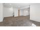 Finished basement with neutral carpet, white walls, and recessed lighting at 25077 E Canal Pl, Aurora, CO 80018