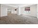 Spacious finished basement boasts neutral carpet and paint, creating a blank canvas for personalization at 25077 E Canal Pl, Aurora, CO 80018