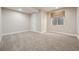 Finished basement room with carpeted floor and window at 25077 E Canal Pl, Aurora, CO 80018