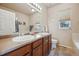 Double vanity bathroom with a large soaking tub at 25077 E Canal Pl, Aurora, CO 80018