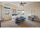 Main bedroom with ceiling fan and en-suite bathroom access at 25077 E Canal Pl, Aurora, CO 80018