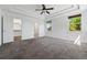 Spacious carpeted main bedroom boasts a walk-in closet, an ensuite bathroom, and ample natural light at 25077 E Canal Pl, Aurora, CO 80018
