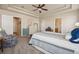 Main bedroom with ceiling fan and walk-in closet at 25077 E Canal Pl, Aurora, CO 80018