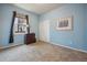 Bright bedroom with carpet, window, and double-door closet at 25077 E Canal Pl, Aurora, CO 80018