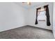 Carpeted bedroom with light and window, ideal for personalized decor and comfortable living at 25077 E Canal Pl, Aurora, CO 80018