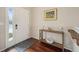 Bright entryway with hardwood floors and console table at 25077 E Canal Pl, Aurora, CO 80018