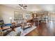 Open concept living and kitchen area with hardwood floors at 25077 E Canal Pl, Aurora, CO 80018