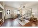 Spacious living room with hardwood floors, fireplace and recessed lighting at 25077 E Canal Pl, Aurora, CO 80018