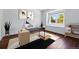 Modern office features a sleek desk, a bright window view, and contemporary decor for a stylish workspace at 25077 E Canal Pl, Aurora, CO 80018