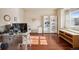 Home office with built-in shelving and hardwood floors at 25077 E Canal Pl, Aurora, CO 80018