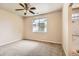 Bright bedroom with a ceiling fan, natural light from the window, and carpeted flooring at 5037 Pelican St, Brighton, CO 80601
