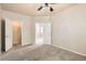 Spacious bedroom showcasing an open doorway and walk-in closet at 5037 Pelican St, Brighton, CO 80601