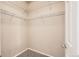 Well-organized walk-in closet with multiple shelves for ample storage at 5037 Pelican St, Brighton, CO 80601