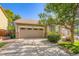 Charming home featuring a two-car garage, well-maintained lawn, and mature trees in a pleasant neighborhood at 5037 Pelican St, Brighton, CO 80601
