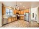 Well-appointed kitchen featuring stainless steel appliances, sleek countertops, and a stylish chandelier, perfect for cooking at 5037 Pelican St, Brighton, CO 80601