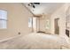 Spacious living area featuring vaulted ceilings, carpeted floors, and large windows providing ample natural light at 5037 Pelican St, Brighton, CO 80601