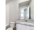 Clean bathroom featuring white cabinets, granite counters and tiled shower at 7244 Arkansas St, Frederick, CO 80530