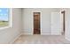 Clean bedroom with closet, plush carpet, and natural light peering through the window at 7244 Arkansas St, Frederick, CO 80530