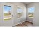 Charming entryway featuring wood flooring and large bright windows at 7244 Arkansas St, Frederick, CO 80530