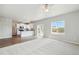 Bright, open floor plan featuring a kitchen with stainless steel appliances connected to the living area at 7244 Arkansas St, Frederick, CO 80530
