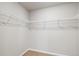 Spacious walk-in closet with wire shelving for maximum storage and organization at 7244 Arkansas St, Frederick, CO 80530