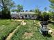 An overgrown backyard of a single Gathering house with assorted objects at 1266 Del Mar Pkwy, Aurora, CO 80010