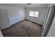 This bedroom has neutral carpet, a window and is freshly painted at 1266 Del Mar Pkwy, Aurora, CO 80010
