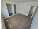 Cozy bedroom featuring plush carpeting, natural light, and a closet at 1266 Del Mar Pkwy, Aurora, CO 80010