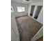 Cozy bedroom featuring plush carpeting, natural light, and closet space for storage at 1266 Del Mar Pkwy, Aurora, CO 80010