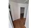 Hallway with wood flooring connects to a bedroom at 1266 Del Mar Pkwy, Aurora, CO 80010