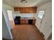 Functional kitchen with ample counter space, wood cabinets, and gas range oven at 1266 Del Mar Pkwy, Aurora, CO 80010