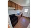 Functional kitchen with gas range, ample cabinet space, and a sink with a view to the backyard at 1266 Del Mar Pkwy, Aurora, CO 80010