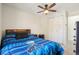 Bedroom featuring a themed bed, ceiling fan, and a closet, creating a cozy and functional space at 6462 E Bates Ave, Denver, CO 80222