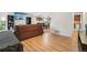Cozy living room featuring hardwood floors and an open layout to the dining area at 6462 E Bates Ave, Denver, CO 80222